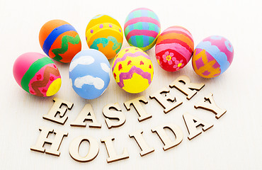 Image showing Colourful easter egg with wooden text