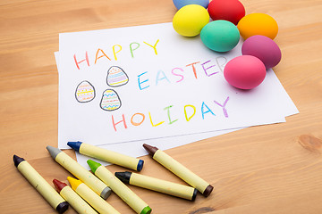 Image showing Colourful easter egg and kid drawing