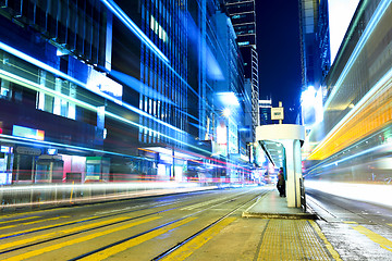 Image showing Busy traffic with tram stop in Hong Kong city