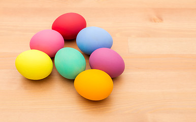 Image showing Colourful easter egg over wooden background