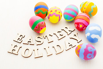 Image showing Painted easter egg with wooden text