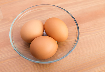 Image showing Brown egg in bowl