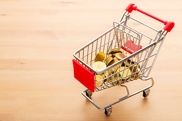 Image showing Golden coin in trolley