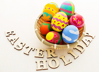 Image showing Painted easter egg with wooden text