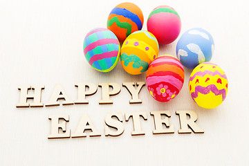 Image showing Painted easter egg and wooden text