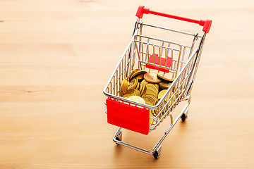 Image showing Trolley with golden coin