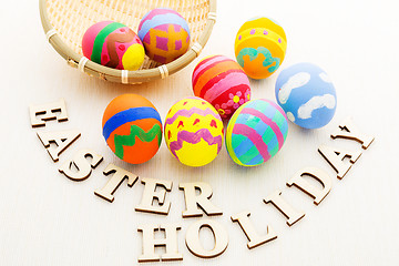 Image showing Colourful design easter egg with wooden word