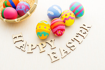 Image showing Painted easter egg with wooden text
