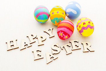 Image showing Decorated easter egg with wooden text