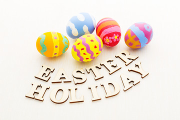 Image showing Colourful easter egg with wooden text