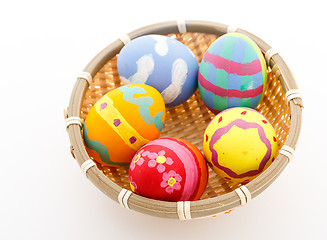 Image showing Easter eggs and basket isolated 