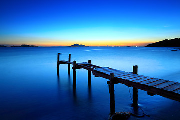 Image showing Sunset seascape with wooden jetty