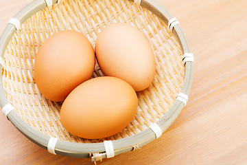 Image showing Brown chicken egg in basket