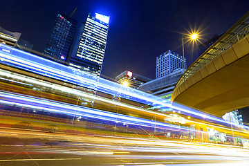 Image showing Fast moving car light in city at night