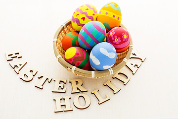 Image showing Colourful design easter egg with wooden word