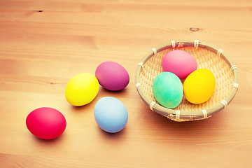 Image showing Colourful painted easter egg and basket