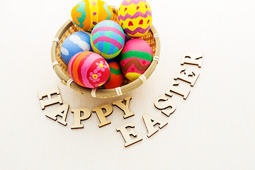 Image showing Colourful design easter egg with wooden word