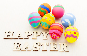 Image showing Painted easter egg with wooden text