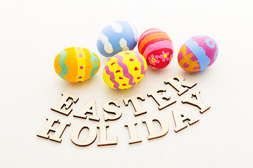 Image showing Colourful easter egg with wooden text