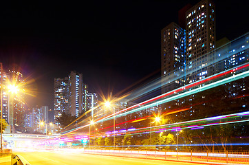 Image showing Fast moving car light in city