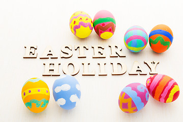 Image showing Colourful easter egg with wooden letter