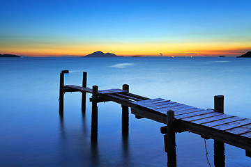 Image showing Wooden bridge with seascape during sunet