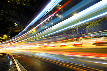 Image showing Fast moving car light on road at night