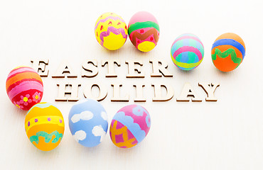 Image showing Kid Painted easter egg with wooden text