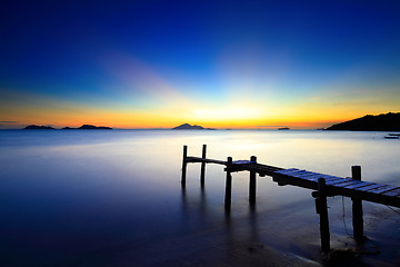 Image showing Sunset seascape with wooden pier