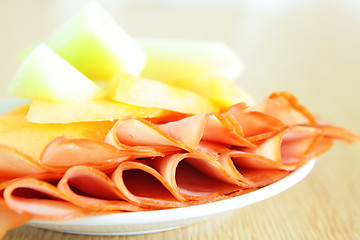 Image showing Ham and melon on dish