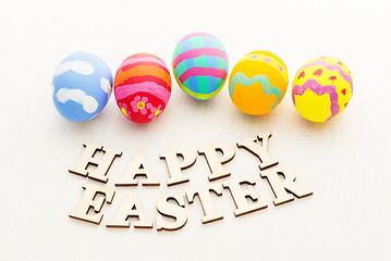 Image showing Colourful design easter egg with wooden word