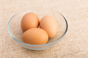 Image showing Egg in bowl over linen background