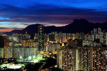 Image showing Kowloon cityscape in Kong Kong with lion rock mountain