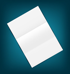 Image showing Empty paper sheet with shadows, on blue background