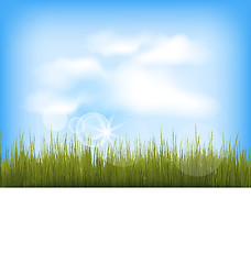 Image showing Summer background with green grass, blue sky, clouds