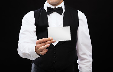 Image showing dealer holding white card