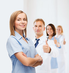 Image showing smiling female doctor or nurse