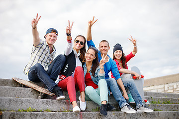 Image showing group of smiling teenagers hanging out
