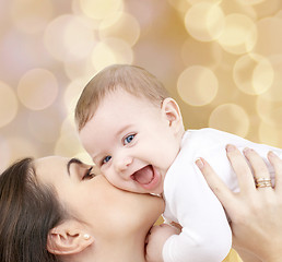 Image showing laughing baby playing with mother