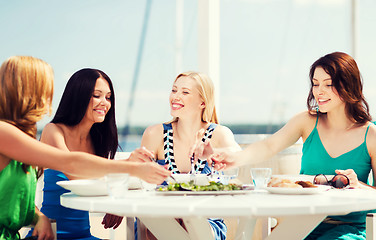 Image showing girls in cafe on the beach