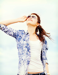 Image showing teenage girl in shades outside