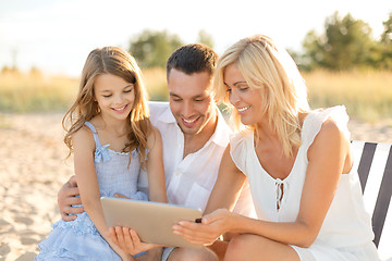 Image showing smiling family at beach with tablet pc computer