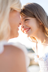 Image showing happy mother and child girl outdoors