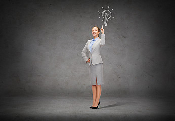 Image showing smiling businesswoman with her finger up
