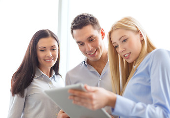 Image showing business team working with tablet pc in office