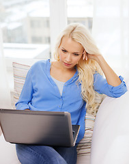 Image showing woman with laptop computer at home