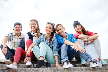 Image showing group of smiling teenagers hanging out