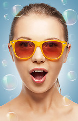 Image showing surprised teenage girl in shades