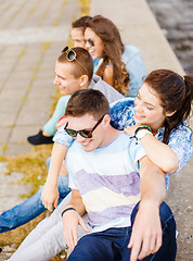 Image showing group of smiling teenagers hanging out