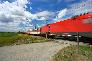 Image showing Train passing through a railway crossing.